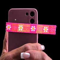 Close-up of pink floral trim on the Friend of God silk worship flag rod pocket.