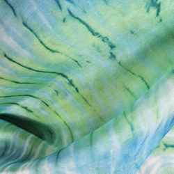 Close-up of Shibori Art hand-dyed silk scarf in green, turquoise and white