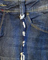 Navy blue & white tzitzits looped on belt loop. Click on image for larger view