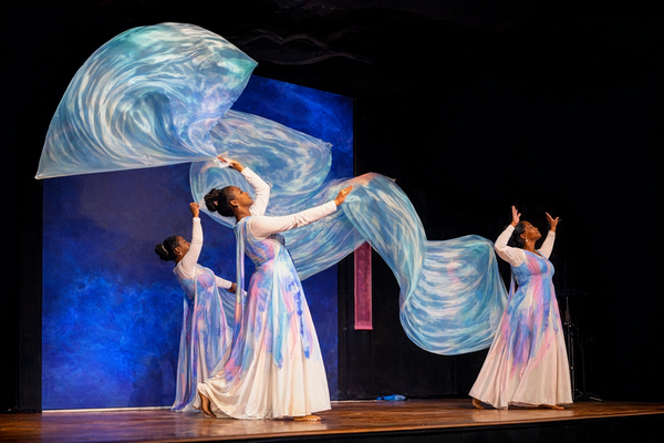 Worshipper using Living Water silk flag sets in motion