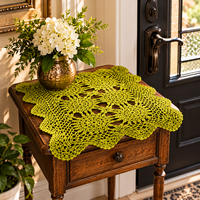 WARRIOR'S PRAYER hand-dyed army green cotton doily displayed on a wooden entryway table with a decorative vase of white flowers — WORSHIP WARRIORS®